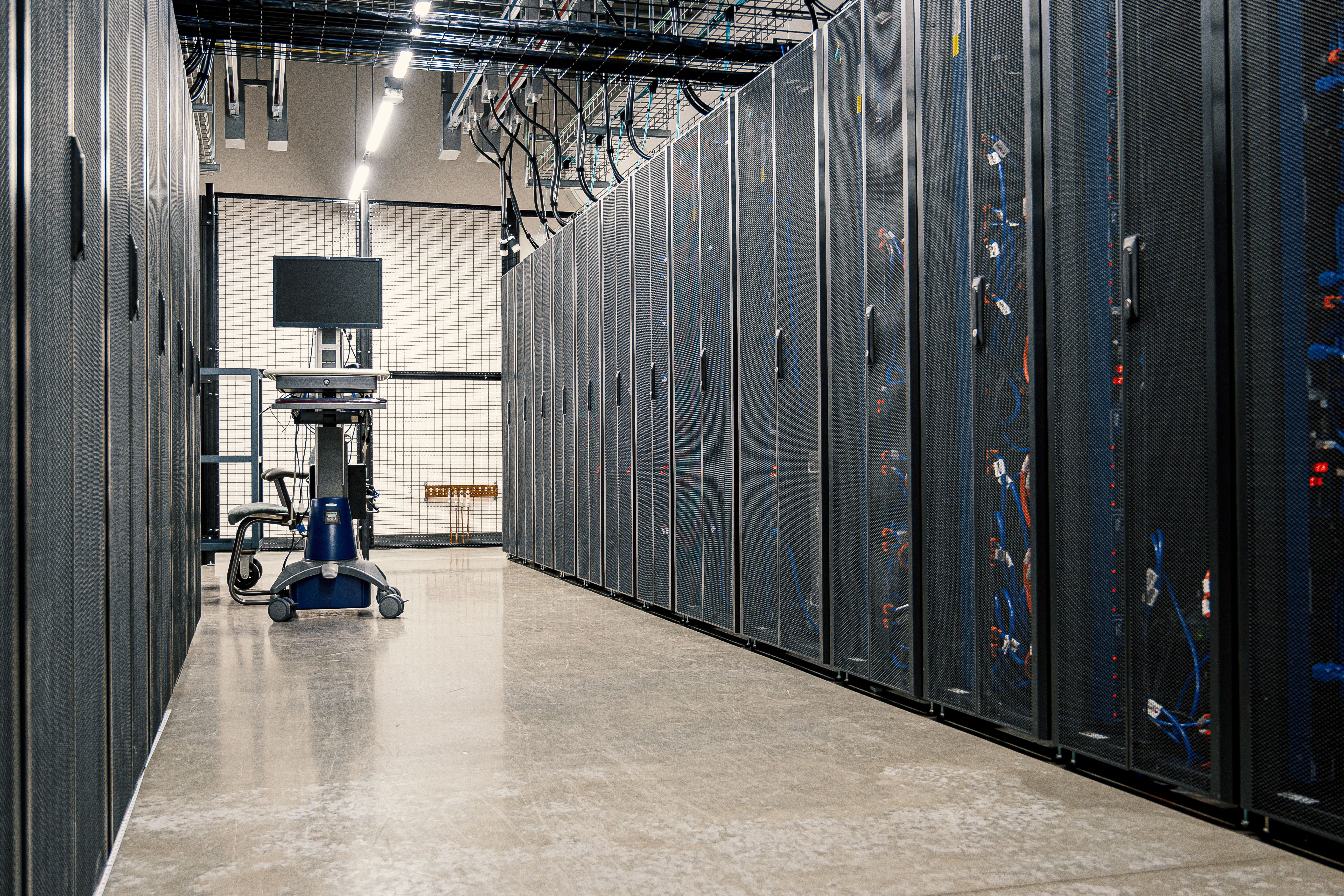 Engineer working on server rack infrastructure