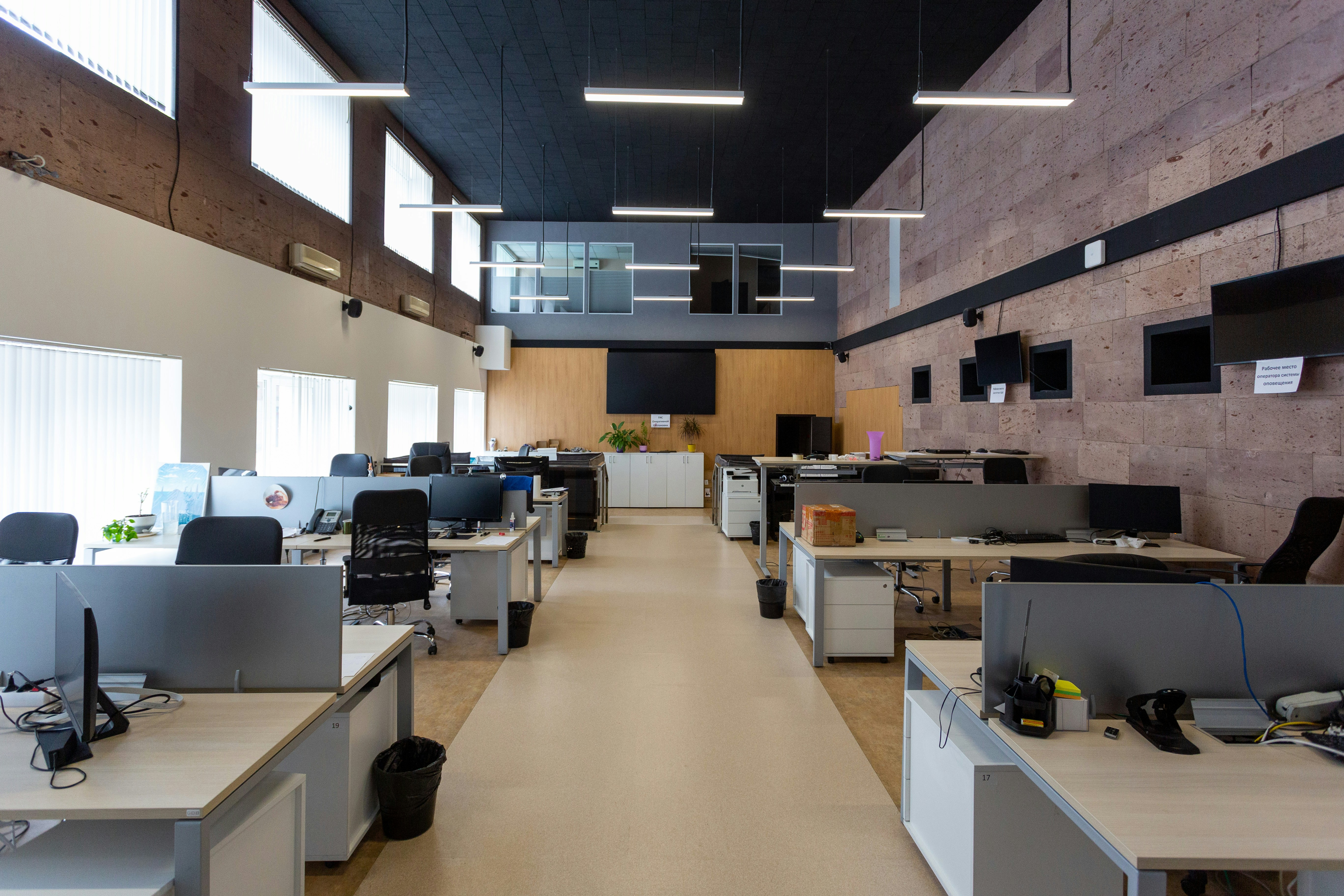Modern open-plan office with teams working at their desks